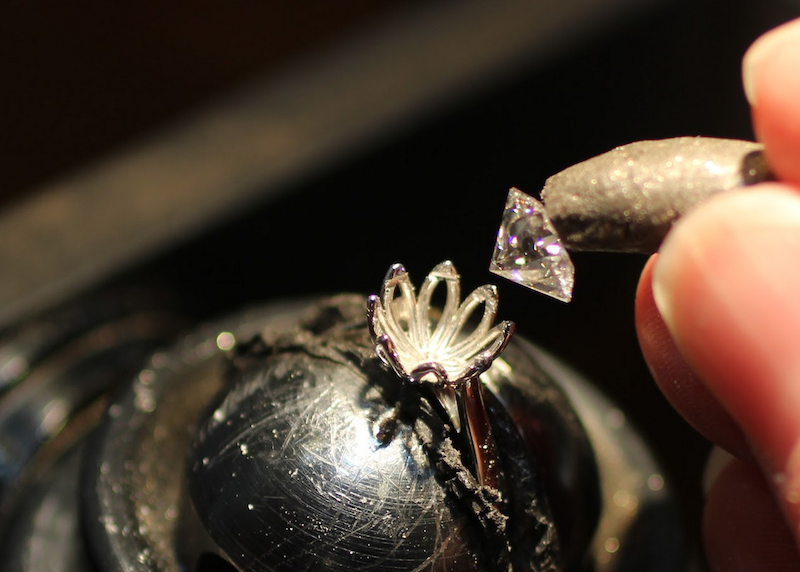 Here's an up-close look at resetting a diamond in a new engagement ring setting.